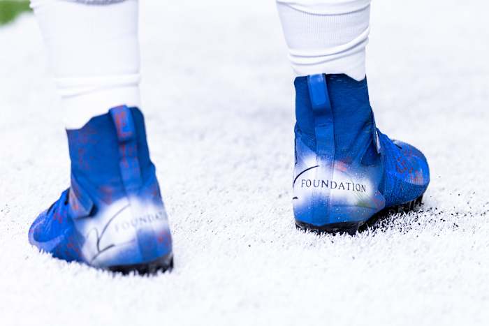 Detroit Lions defensive end Josh Paschal's blue and white cleats.